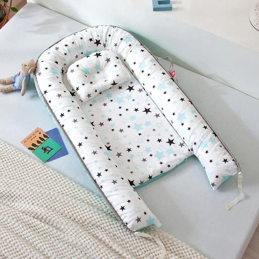 Réducteur de lit bébé pour voyage