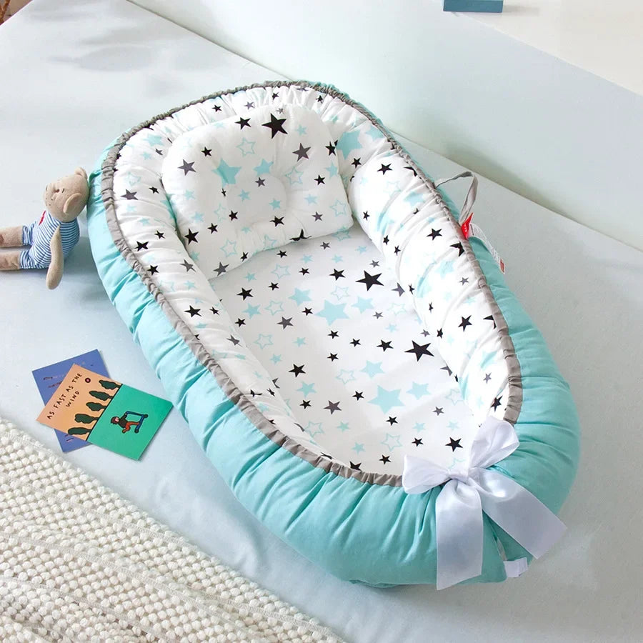 Réducteur de lit bébé pour voyage