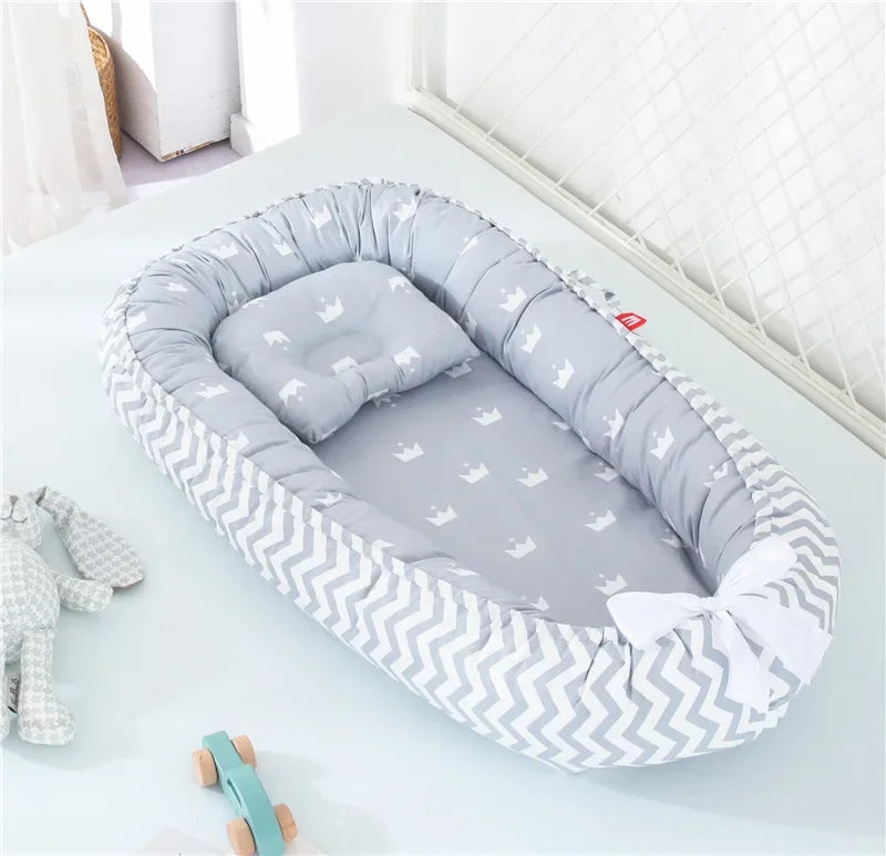 Réducteur de lit bébé pour voyage