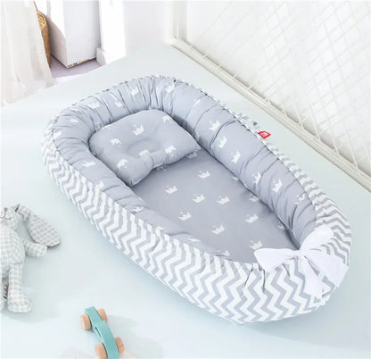 Réducteur de lit bébé pour voyage