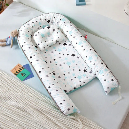 Réducteur de lit bébé pour voyage