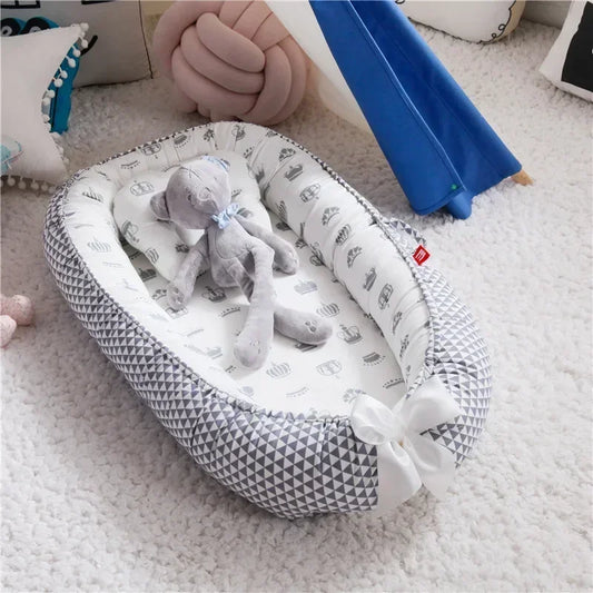 Réducteur de lit bébé pour voyage