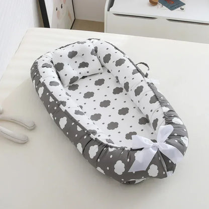 Réducteur de lit bébé pour voyage