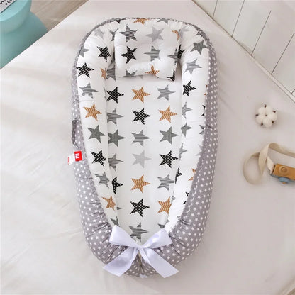 Réducteur de lit bébé pour voyage