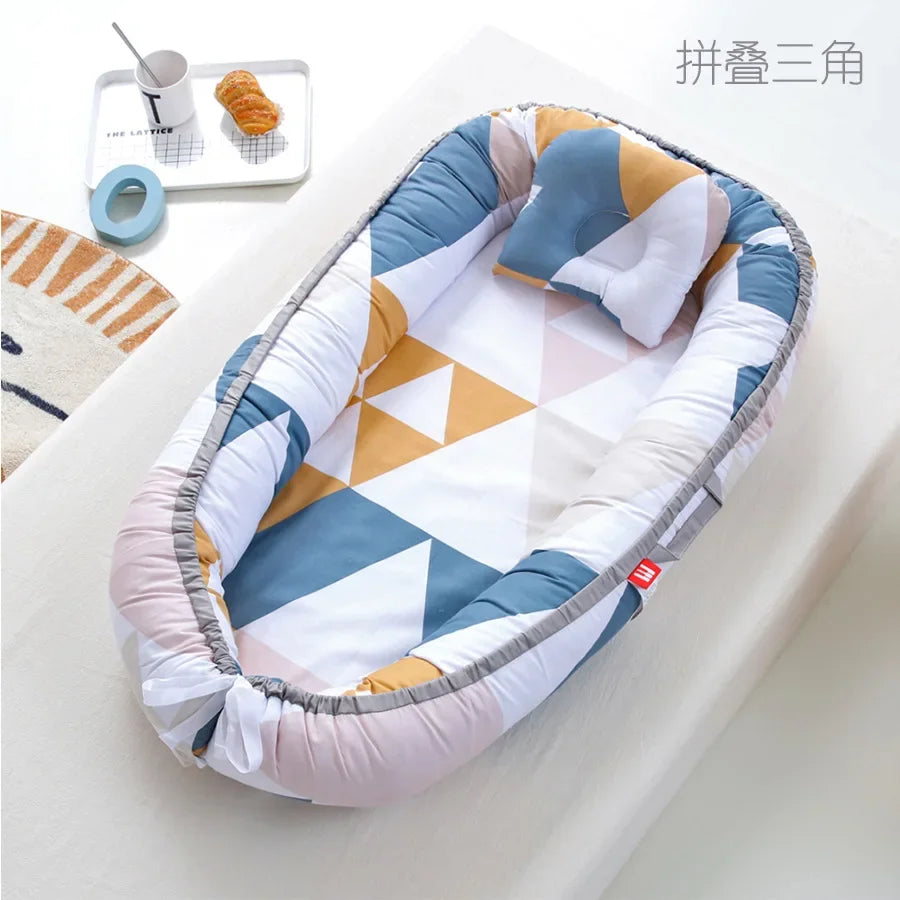 Réducteur de lit bébé pour voyage