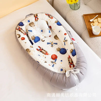 Réducteur de lit bébé pour voyage
