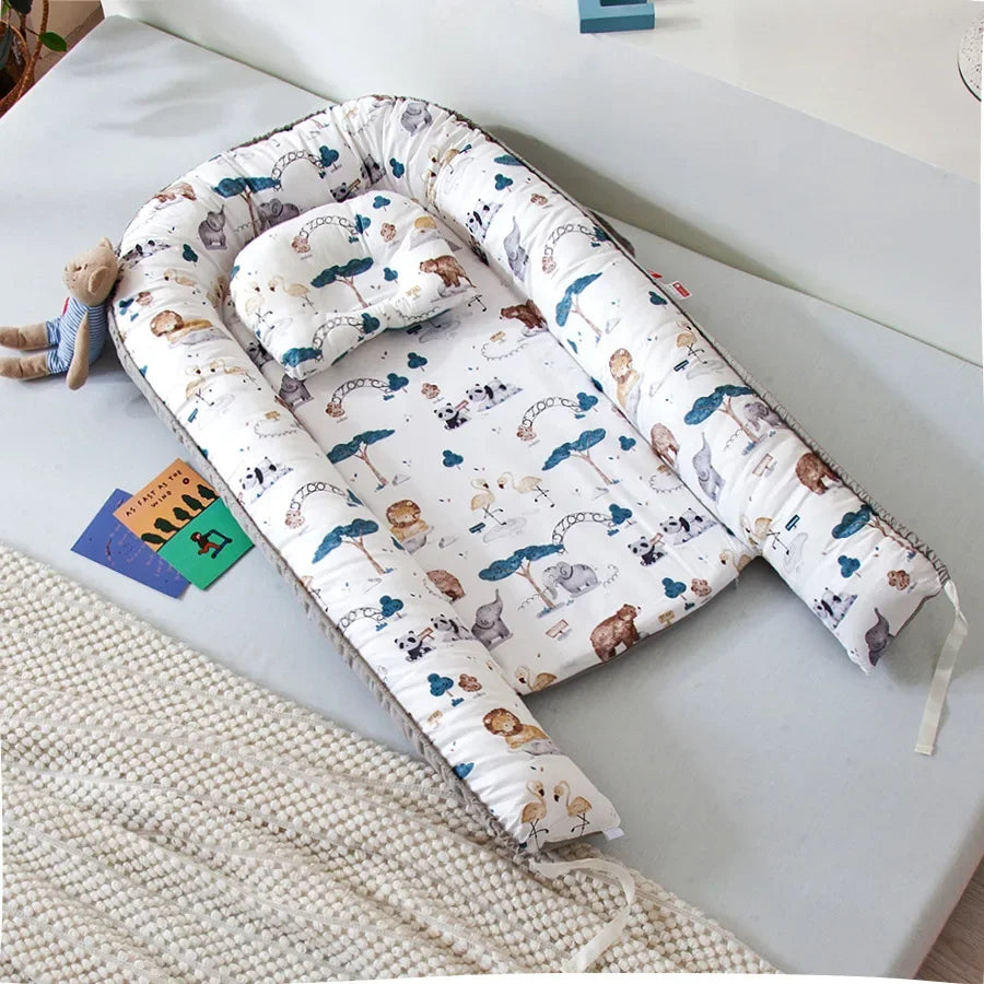 Réducteur de lit bébé pour voyage