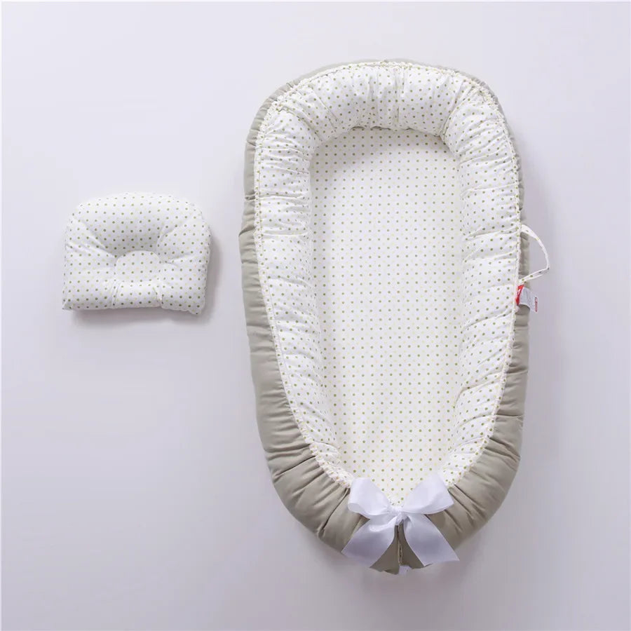 Réducteur de lit bébé pour voyage