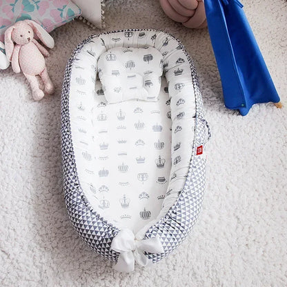 Réducteur de lit bébé pour voyage