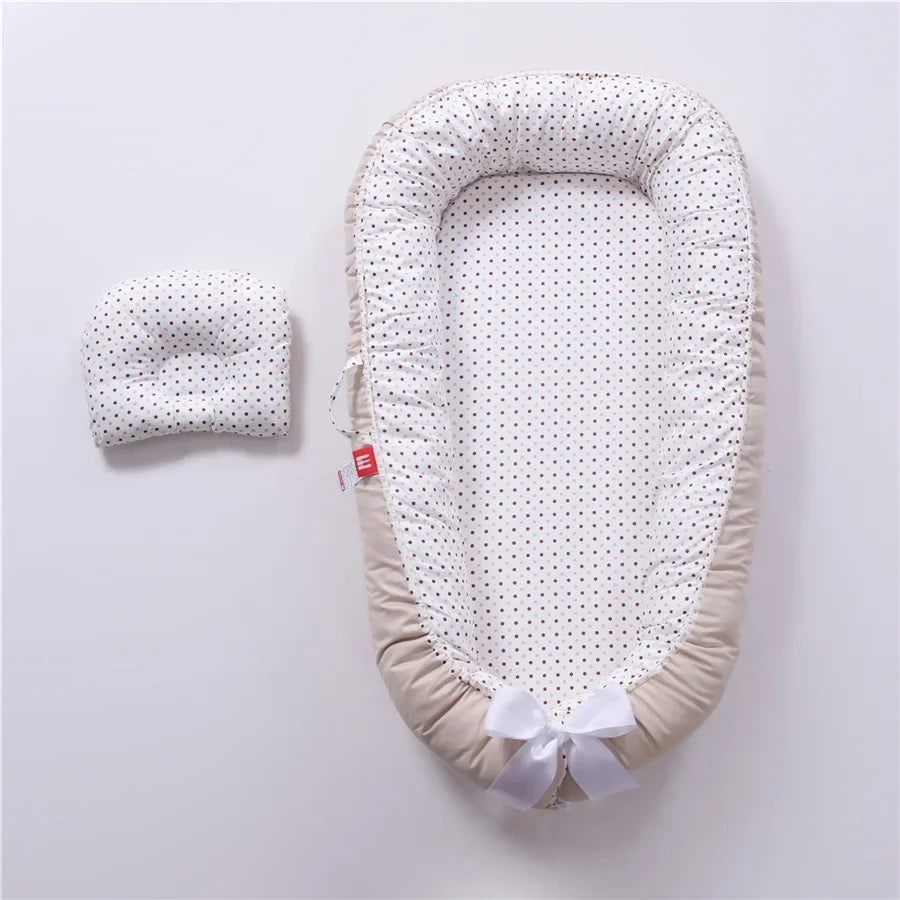 Réducteur de lit bébé pour voyage
