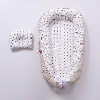 Réducteur de lit bébé pour voyage