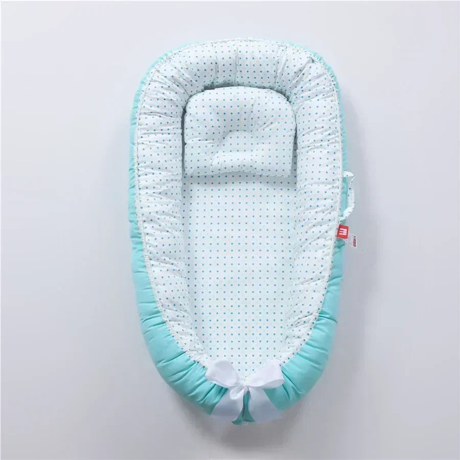 Réducteur de lit bébé pour voyage