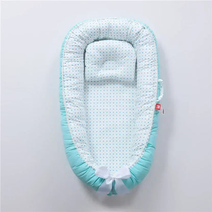 Réducteur de lit bébé pour voyage