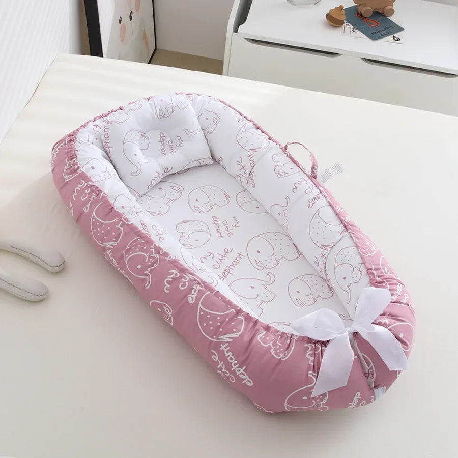 Réducteur de lit bébé pour voyage