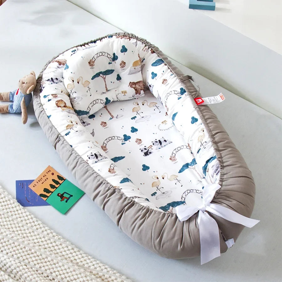 Réducteur de lit bébé pour voyage
