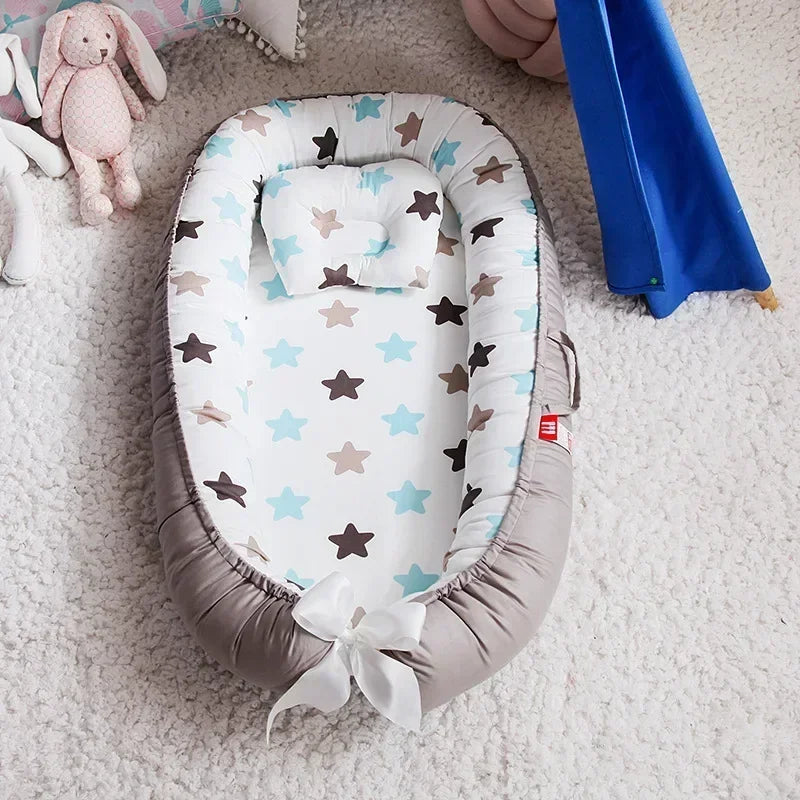 Réducteur de lit bébé pour voyage