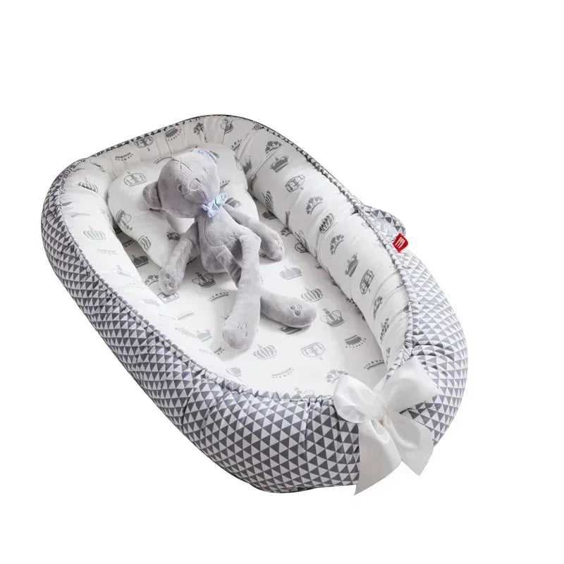 Réducteur de lit bébé pour voyage