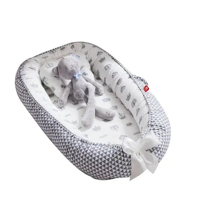Réducteur de lit bébé pour voyage