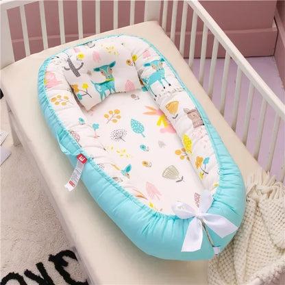 Réducteur de lit bébé pour voyage