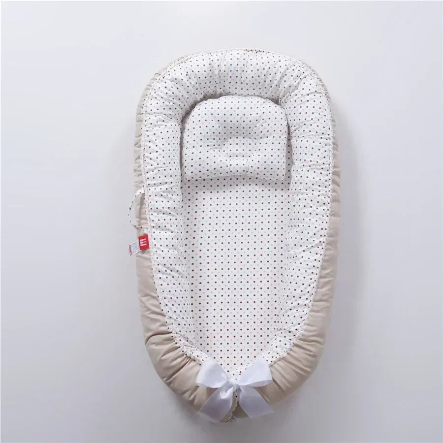 Réducteur de lit bébé pour voyage