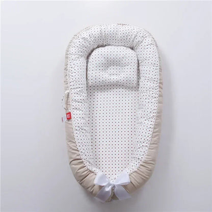 Réducteur de lit bébé pour voyage