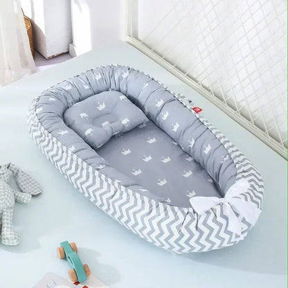 Réducteur de lit bébé pour voyage