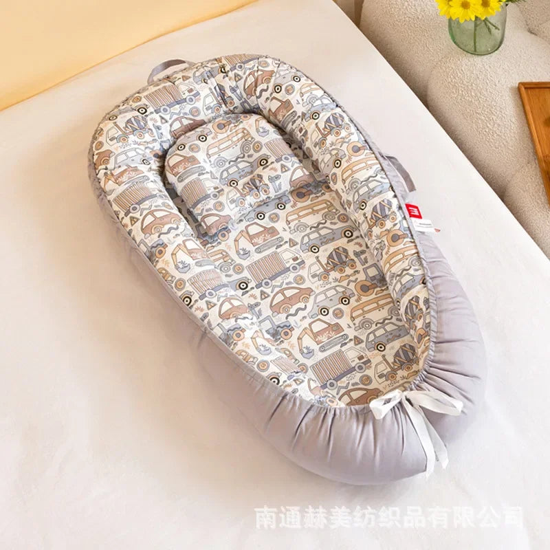 Réducteur de lit bébé pour voyage