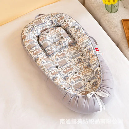 Réducteur de lit bébé pour voyage