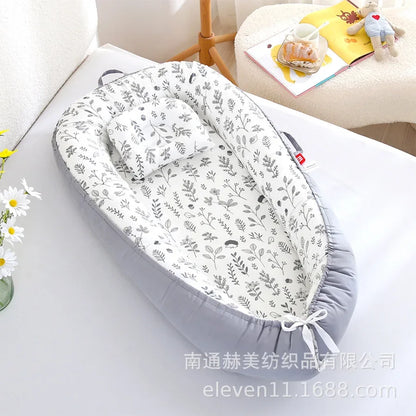Réducteur de lit bébé pour voyage