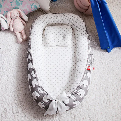 Réducteur de lit bébé portatif