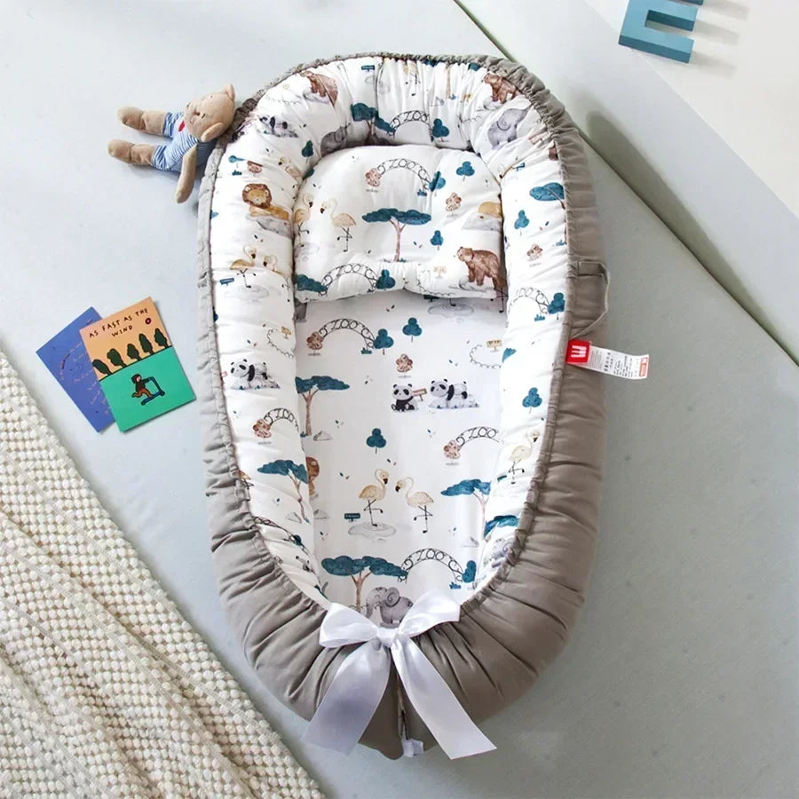 Réducteur de lit bébé pour voyage