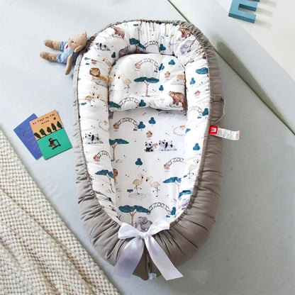 Réducteur de lit bébé pour voyage