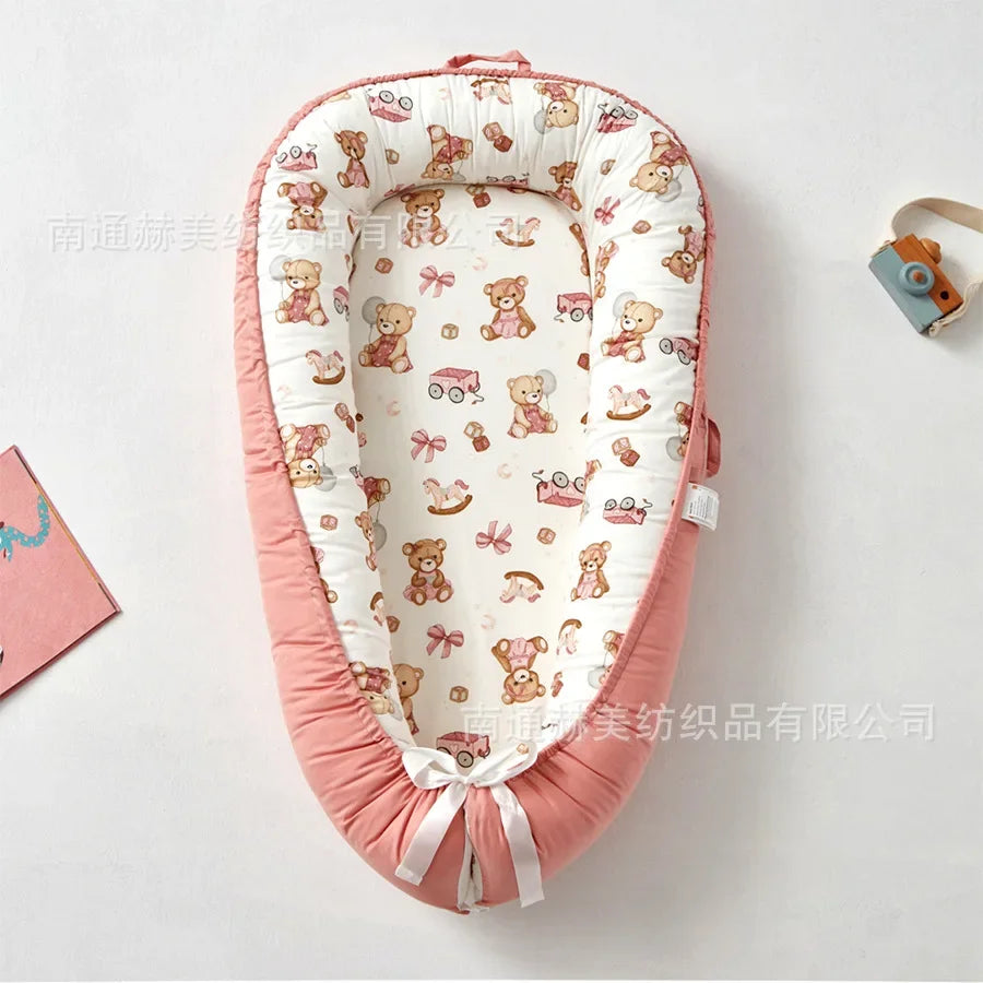 Réducteur de lit bébé pour voyage