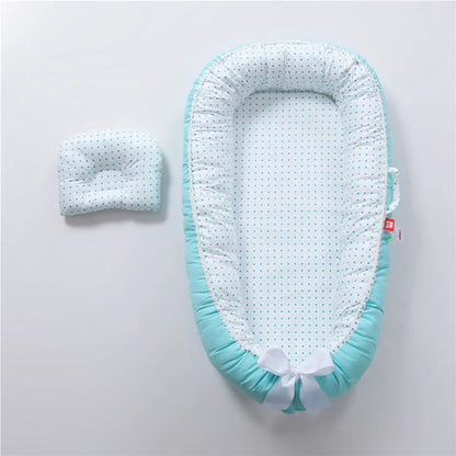 Réducteur de lit bébé pour voyage