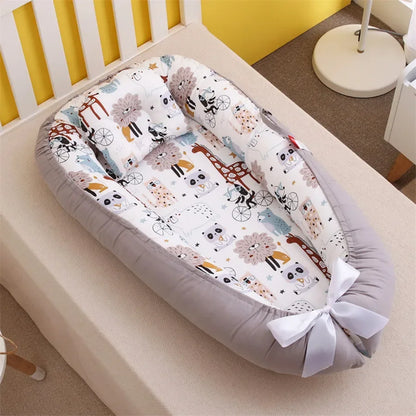 Réducteur de lit bébé pour voyage